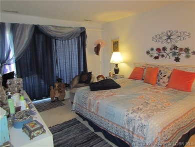 Top-floor waterfront condo featuring 3 bedrooms, 2 bathrooms on Seasons Ridge At Four Seasons in Missouri - for sale on GolfHomes.com, golf home, golf lot