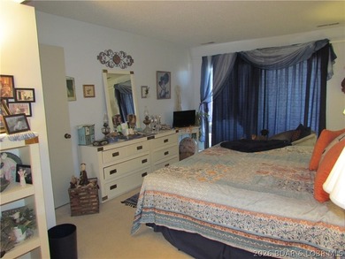 Top-floor waterfront condo featuring 3 bedrooms, 2 bathrooms on Seasons Ridge At Four Seasons in Missouri - for sale on GolfHomes.com, golf home, golf lot