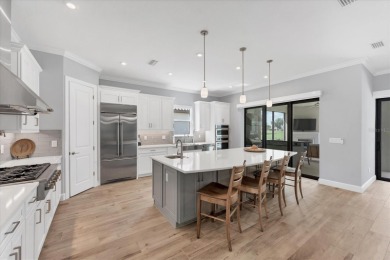 EXQUISITELY DESIGNED POOL HOME IN THE PREMIERE GOLF COMMUNITY OF on Esplanade Golf and Country at Lakewood Ranch in Florida - for sale on GolfHomes.com, golf home, golf lot