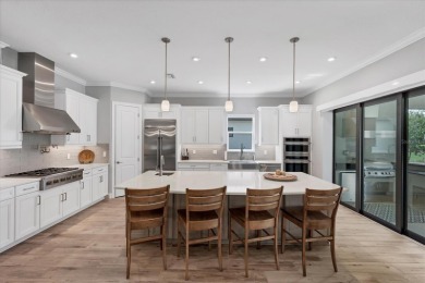 EXQUISITELY DESIGNED POOL HOME IN THE PREMIERE GOLF COMMUNITY OF on Esplanade Golf and Country at Lakewood Ranch in Florida - for sale on GolfHomes.com, golf home, golf lot