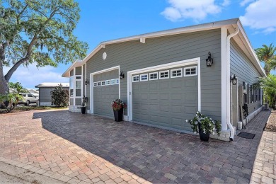 Introducing a captivating mobile home nestled in the serene on Silver Dollar Golf and Trap Club in Florida - for sale on GolfHomes.com, golf home, golf lot