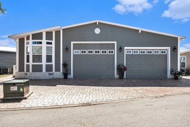 Introducing a captivating mobile home nestled in the serene on Silver Dollar Golf and Trap Club in Florida - for sale on GolfHomes.com, golf home, golf lot