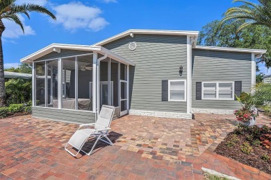 Introducing a captivating mobile home nestled in the serene on Silver Dollar Golf and Trap Club in Florida - for sale on GolfHomes.com, golf home, golf lot