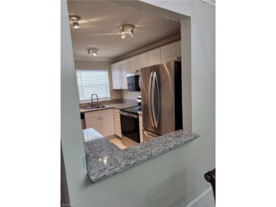 Charming pristine condo with 2 master suites and parking right on Quail Run Golf Club In Naples in Florida - for sale on GolfHomes.com, golf home, golf lot