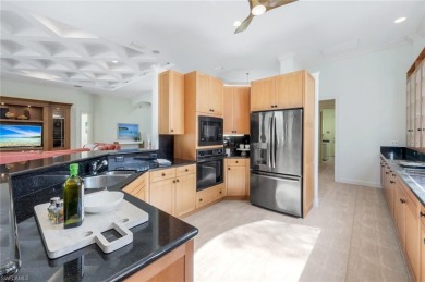 Immerse yourself in the ultimate expression of luxury living at on Shadow Wood Country Club in Florida - for sale on GolfHomes.com, golf home, golf lot