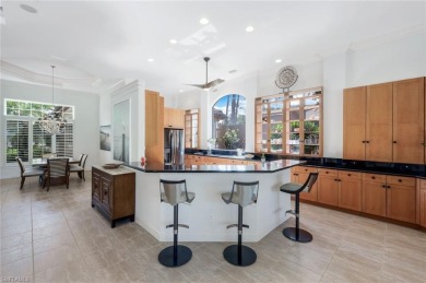 Immerse yourself in the ultimate expression of luxury living at on Shadow Wood Country Club in Florida - for sale on GolfHomes.com, golf home, golf lot