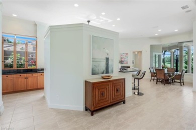 Immerse yourself in the ultimate expression of luxury living at on Shadow Wood Country Club in Florida - for sale on GolfHomes.com, golf home, golf lot