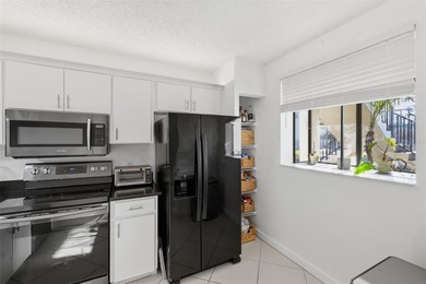 Welcome to resort-style living in the highly desirable Feather on Feather Sound Country Club in Florida - for sale on GolfHomes.com, golf home, golf lot