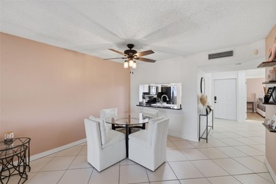 Welcome to resort-style living in the highly desirable Feather on Feather Sound Country Club in Florida - for sale on GolfHomes.com, golf home, golf lot