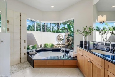 Immerse yourself in the ultimate expression of luxury living at on Shadow Wood Country Club in Florida - for sale on GolfHomes.com, golf home, golf lot