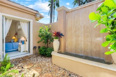 Immerse yourself in the ultimate expression of luxury living at on Shadow Wood Country Club in Florida - for sale on GolfHomes.com, golf home, golf lot