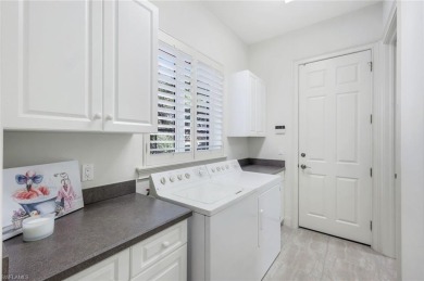 Immerse yourself in the ultimate expression of luxury living at on Shadow Wood Country Club in Florida - for sale on GolfHomes.com, golf home, golf lot