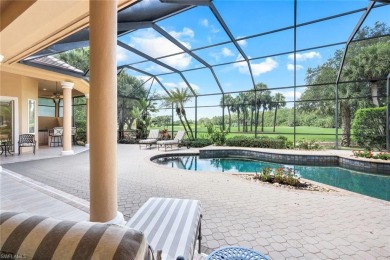 Immerse yourself in the ultimate expression of luxury living at on Shadow Wood Country Club in Florida - for sale on GolfHomes.com, golf home, golf lot