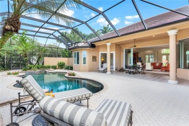 Immerse yourself in the ultimate expression of luxury living at on Shadow Wood Country Club in Florida - for sale on GolfHomes.com, golf home, golf lot