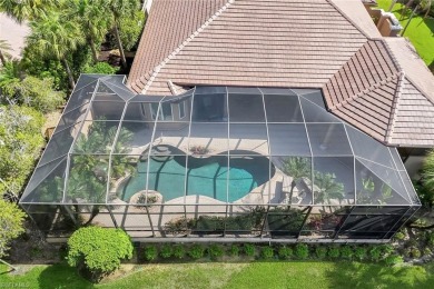 Immerse yourself in the ultimate expression of luxury living at on Shadow Wood Country Club in Florida - for sale on GolfHomes.com, golf home, golf lot