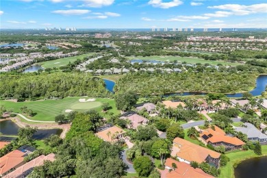 Immerse yourself in the ultimate expression of luxury living at on Shadow Wood Country Club in Florida - for sale on GolfHomes.com, golf home, golf lot