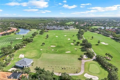 Immerse yourself in the ultimate expression of luxury living at on Shadow Wood Country Club in Florida - for sale on GolfHomes.com, golf home, golf lot