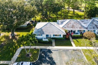 Welcome to 605 Club Drive--a light-filled 2-bedroom, 2-bath on PGA National Golf Club in Florida - for sale on GolfHomes.com, golf home, golf lot
