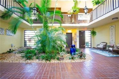 Enjoy first floor living with fantastic views from every room on Martin County Golf Course in Florida - for sale on GolfHomes.com, golf home, golf lot
