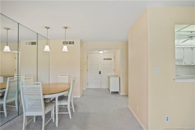 Enjoy first floor living with fantastic views from every room on Martin County Golf Course in Florida - for sale on GolfHomes.com, golf home, golf lot
