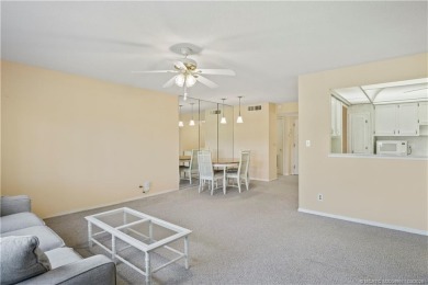Enjoy first floor living with fantastic views from every room on Martin County Golf Course in Florida - for sale on GolfHomes.com, golf home, golf lot