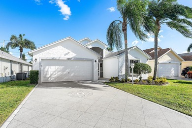 Pride of ownership shines in this immaculate, well-maintained on Cypress Lakes Golf Course - West Palm Beach in Florida - for sale on GolfHomes.com, golf home, golf lot