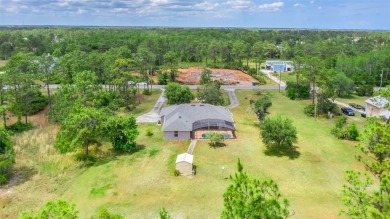 MUST SEE 4/2 POOL home sitting on 1.24 acres!  This well on Wedgefield Golf Club in Florida - for sale on GolfHomes.com, golf home, golf lot