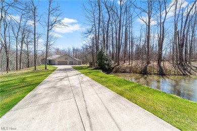 Situated on 6+ acres of serene wooded property, this seller on Tanglewood National Golf Club in Ohio - for sale on GolfHomes.com, golf home, golf lot