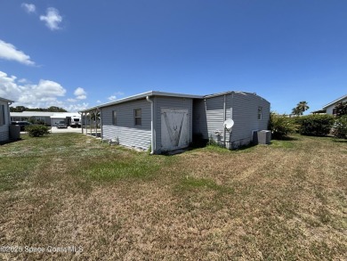 Residential or Investor Opportunity. This classic 2-bedroom, 2 on Barefoot Bay Golf Course in Florida - for sale on GolfHomes.com, golf home, golf lot