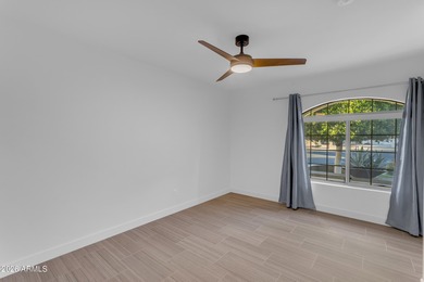 This beautiful home blends modern upgrades with resort-style on Tuscany Falls At Pebble Creek in Arizona - for sale on GolfHomes.com, golf home, golf lot