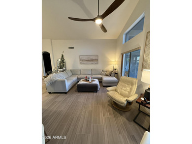 This beautiful home blends modern upgrades with resort-style on Tuscany Falls At Pebble Creek in Arizona - for sale on GolfHomes.com, golf home, golf lot