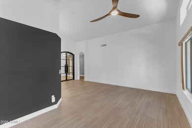 This beautiful home blends modern upgrades with resort-style on Tuscany Falls At Pebble Creek in Arizona - for sale on GolfHomes.com, golf home, golf lot