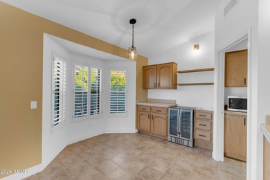 This beautiful home blends modern upgrades with resort-style on Tuscany Falls At Pebble Creek in Arizona - for sale on GolfHomes.com, golf home, golf lot