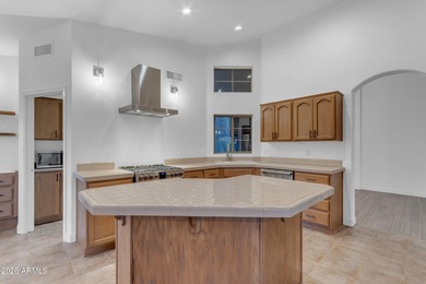 This beautiful home blends modern upgrades with resort-style on Tuscany Falls At Pebble Creek in Arizona - for sale on GolfHomes.com, golf home, golf lot