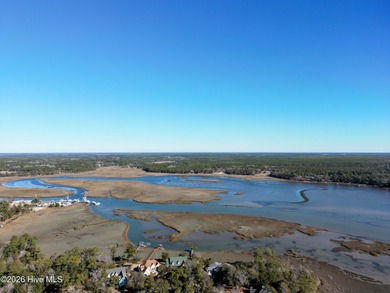 Set on more than half an acre, this surveyed and partially on Lockwood Folly Country Club in North Carolina - for sale on GolfHomes.com, golf home, golf lot