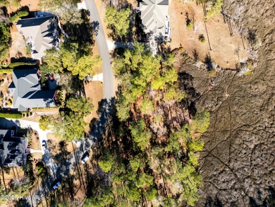 Set on more than half an acre, this surveyed and partially on Lockwood Folly Country Club in North Carolina - for sale on GolfHomes.com, golf home, golf lot