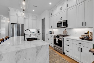 This contemporary home in Myrtle Beach offers clean design and on Cane Patch Driving Range in South Carolina - for sale on GolfHomes.com, golf home, golf lot