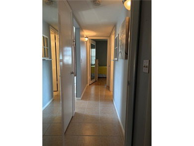 Beautiful first-floor condo in a desirable 55+ community with on The American Golf Club in Florida - for sale on GolfHomes.com, golf home, golf lot