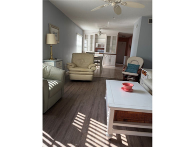 Beautiful first-floor condo in a desirable 55+ community with on The American Golf Club in Florida - for sale on GolfHomes.com, golf home, golf lot