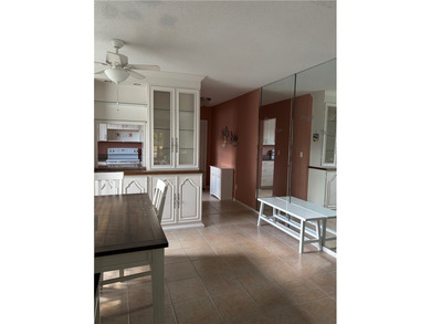 Beautiful first-floor condo in a desirable 55+ community with on The American Golf Club in Florida - for sale on GolfHomes.com, golf home, golf lot