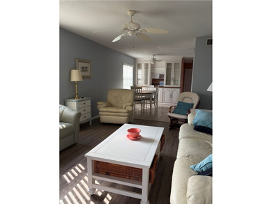 Beautiful first-floor condo in a desirable 55+ community with on The American Golf Club in Florida - for sale on GolfHomes.com, golf home, golf lot