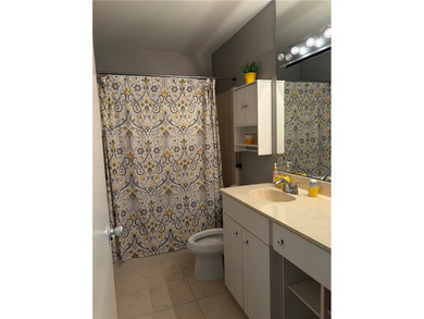 Beautiful first-floor condo in a desirable 55+ community with on The American Golf Club in Florida - for sale on GolfHomes.com, golf home, golf lot