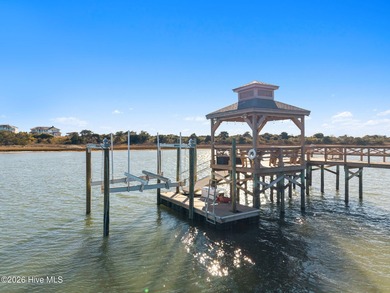 Intracoastal Waterway front luxury home with private dock on Lockwood Folly Country Club in North Carolina - for sale on GolfHomes.com, golf home, golf lot