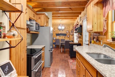 This beautifully maintained log home offers charm, character on Lake Mohawk Golf Club in Ohio - for sale on GolfHomes.com, golf home, golf lot
