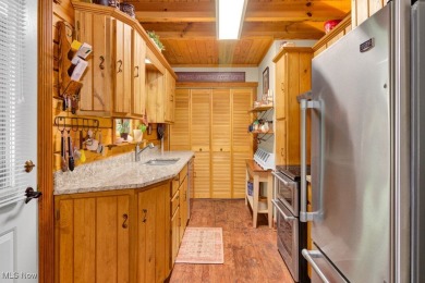 This beautifully maintained log home offers charm, character on Lake Mohawk Golf Club in Ohio - for sale on GolfHomes.com, golf home, golf lot