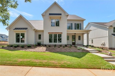 This beautifully designed 5-bedroom home with two bedrooms on on The Georgia Club in Georgia - for sale on GolfHomes.com, golf home, golf lot