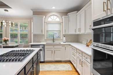 Discover timeless elegance and modern comfort in this on Woodmont Golf and Country Club in Georgia - for sale on GolfHomes.com, golf home, golf lot