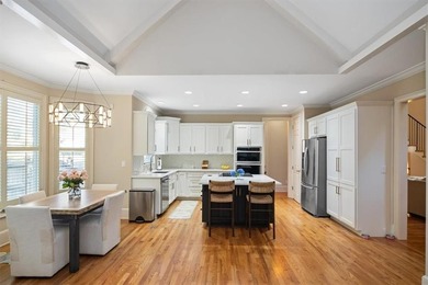 Discover timeless elegance and modern comfort in this on Woodmont Golf and Country Club in Georgia - for sale on GolfHomes.com, golf home, golf lot