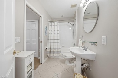 Fresh, light-filled and offered turnkey, this first-floor coach on The Rookery At Marco in Florida - for sale on GolfHomes.com, golf home, golf lot