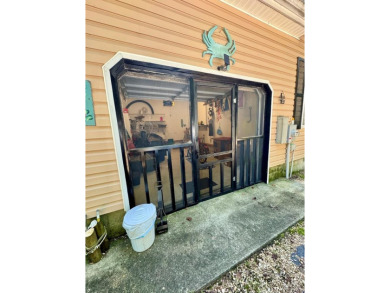 This cozy 2 bedroom 2 bath home located in a quiet section of on Captains Cove Golf and Yacht Club in Virginia - for sale on GolfHomes.com, golf home, golf lot